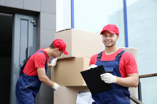 Team loading moving items safely from a van