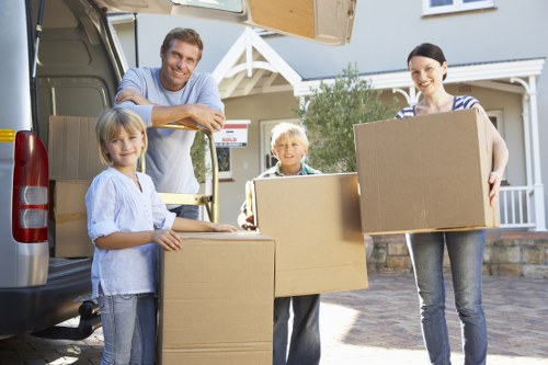 Professional movers handling bulky furniture in Kingston Upon Thames